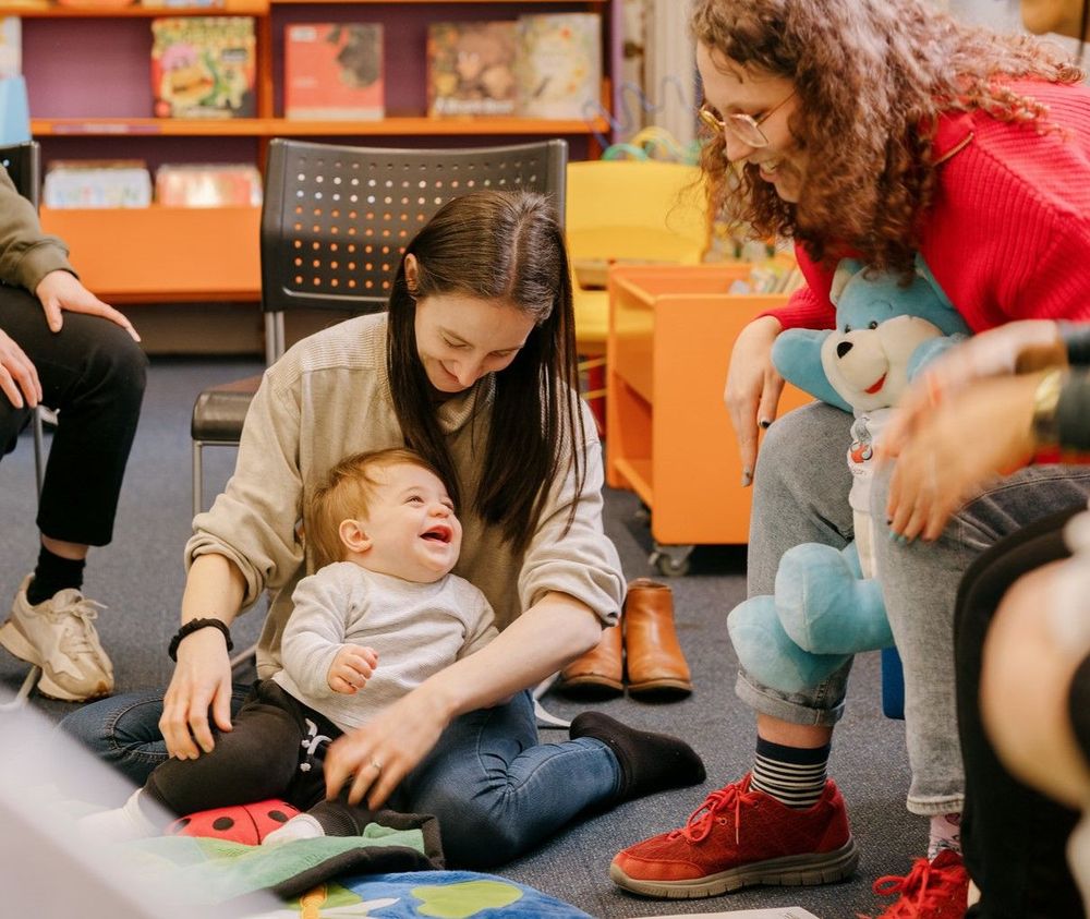 A rhyme time group of parents and babies at their local library